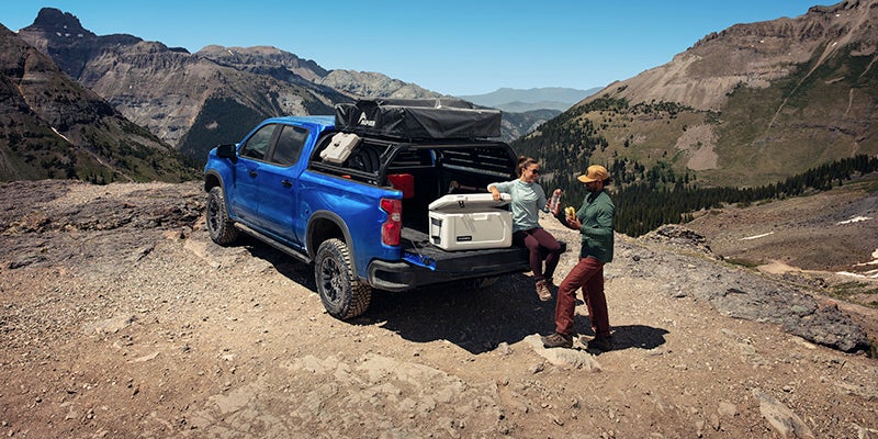 2025 Chevrolet Silverado 1500 couple sitting on tailgate