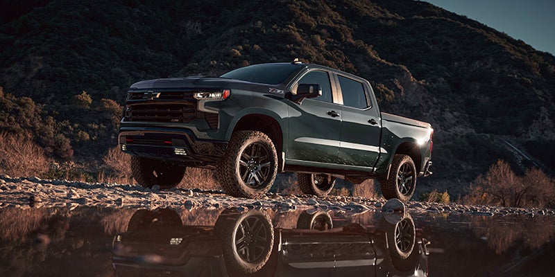 2025 Chevrolet Silverado 1500 driving across creekbed